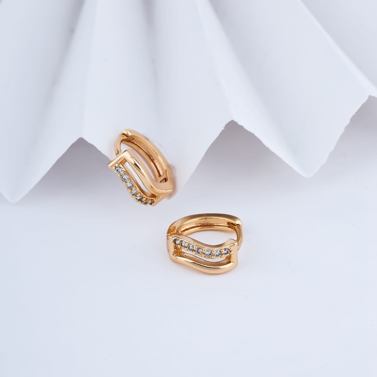 Aurelia Crystal Curve Gold Huggie Earrings